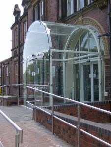 Frameless Structural glazing system built over an existing entrance with clever curved sections